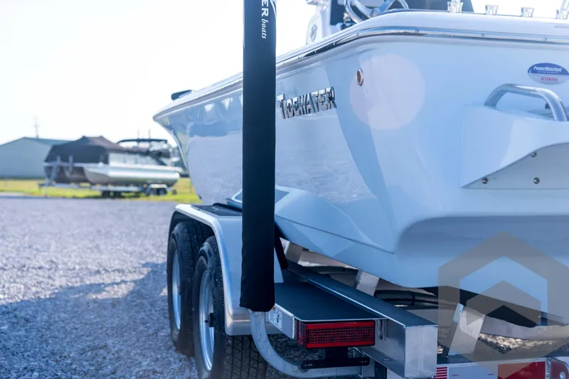 Slide: The Image of 2026 Tidewater 2110 Bay Max boat on trailer, parked on gravel lot. - 23