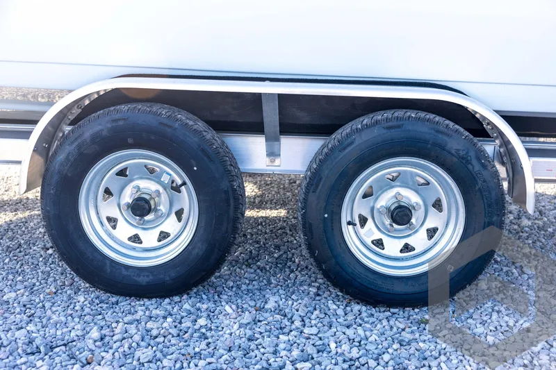 Slide: The Image of Trailer wheels of a 2026 Tidewater 2110 Bay Max on gravel surface. - 27
