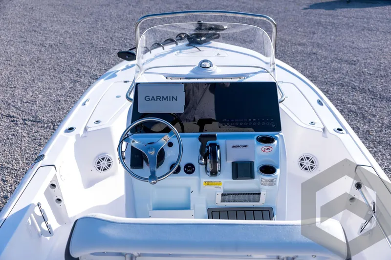 Slide: The Image of 2026 Tidewater 2110 Bay Max boat dashboard with Garmin navigation and Mercury controls. - 32