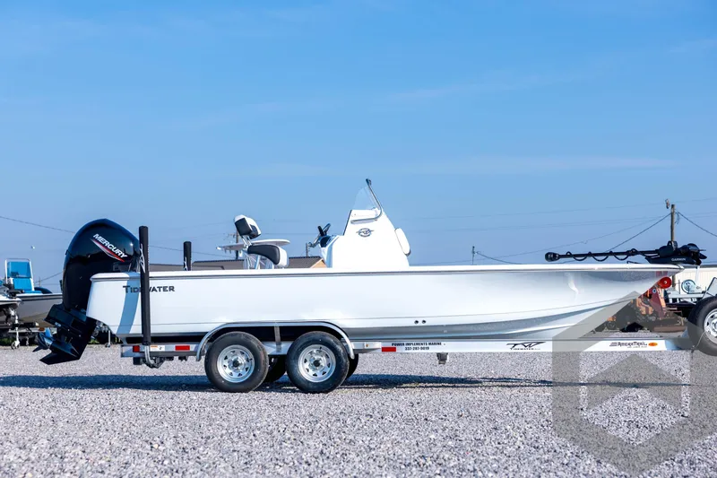 Slide: The Image of 2026 Tidewater 2110 Bay Max boat on trailer, side view, clear sky background. - 4