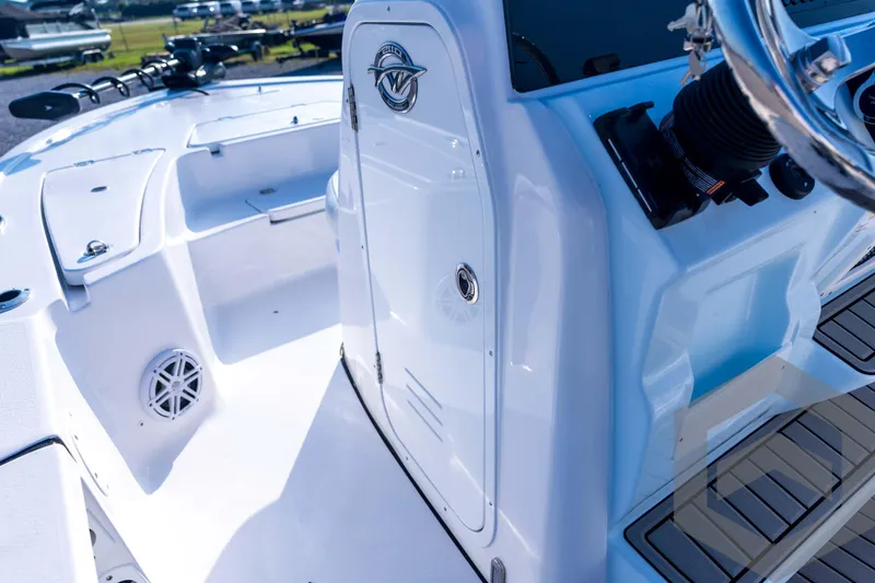 Slide: The Image of 2026 Tidewater 2110 Bay Max boat interior with steering console and seating area. - 43