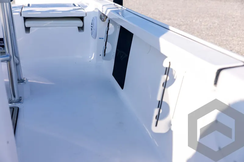 Slide: The Image of 2026 Tidewater 2110 Bay Max boat interior, featuring sleek white design and seating area. - 46