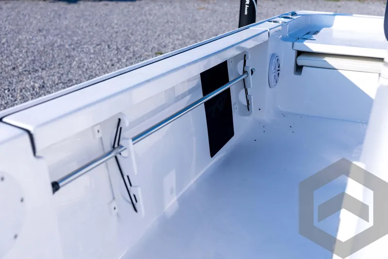 Slide: The Image of 2026 Tidewater 2110 Bay Max boat interior with rod holder and storage features. - 47
