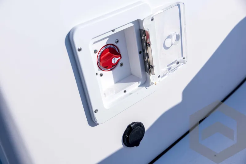 Slide: The Image of 2026 Tidewater 2110 Bay Max boat battery switch with protective cover. - 48