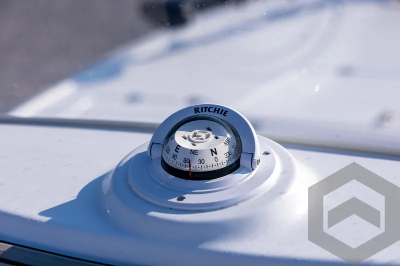 Slide: The Image of Compass on 2026 Tidewater 2110 Bay Max boat dashboard, close-up view. - 52