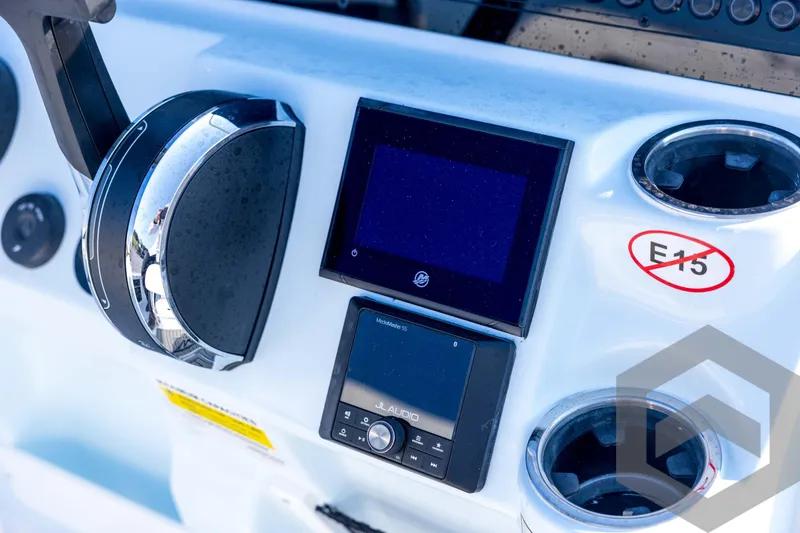 Slide: The Image of Close-up of 2026 Tidewater 2110 Bay Max boat dashboard with controls and display. - 53