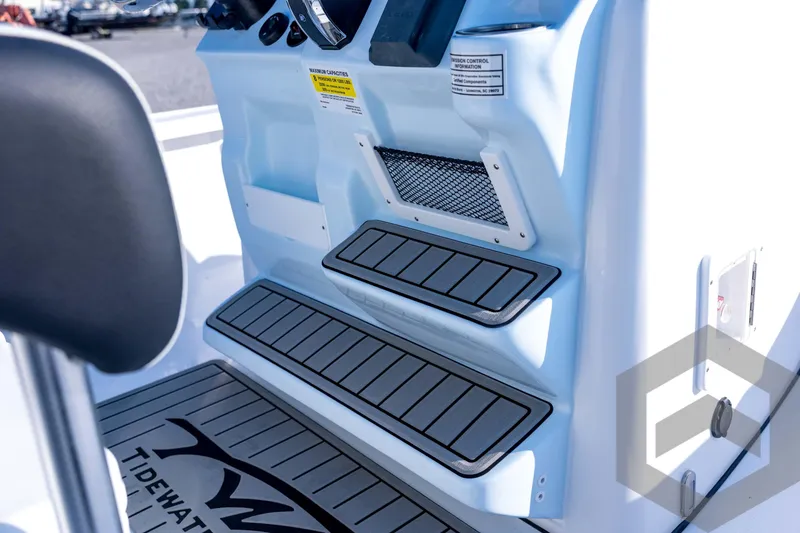 Slide: The Image of 2026 Tidewater 2110 Bay Max boat interior with non-slip steps and control panel. - 54