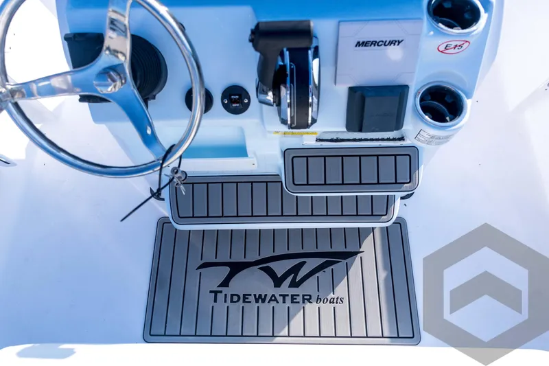 Slide: The Image of 2026 Tidewater 2110 Bay Max boat console with steering wheel and Mercury controls. - 60