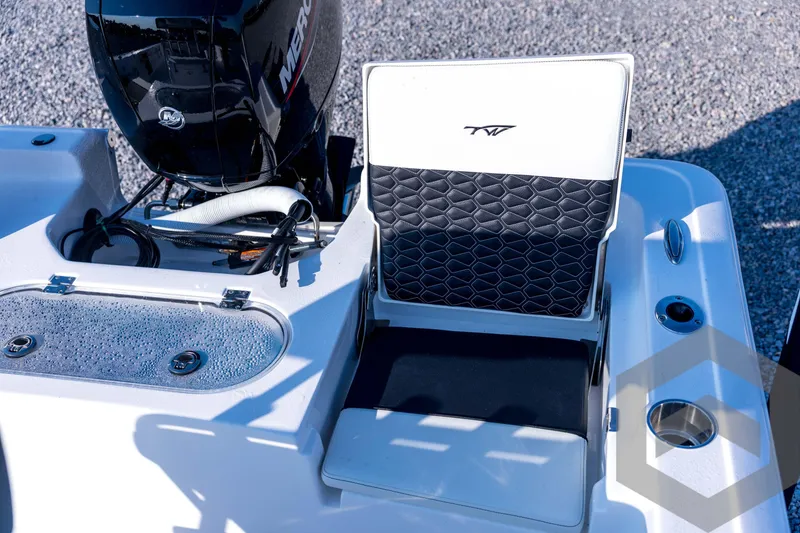 Slide: The Image of 2026 Tidewater 2110 Bay Max boat interior with seating and engine detail. - 66