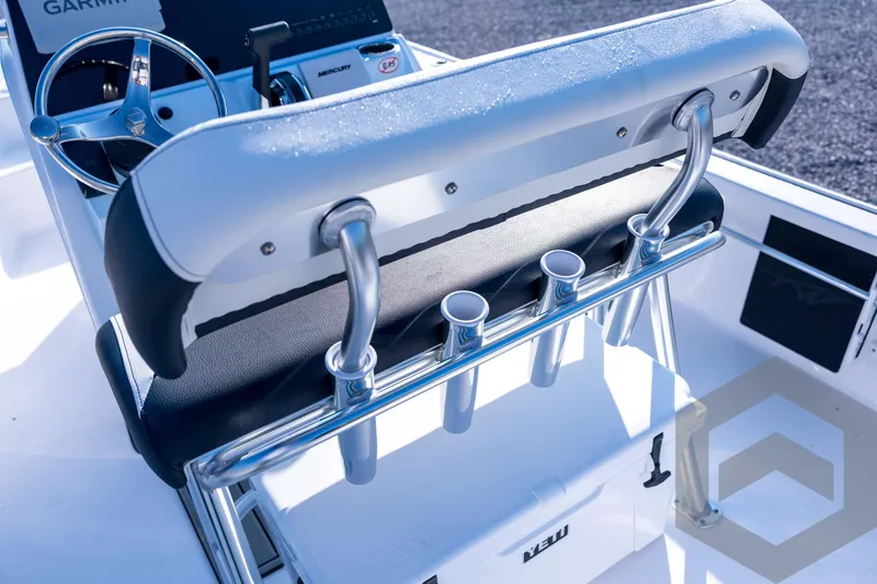 Slide: The Image of 2026 Tidewater 2110 Bay Max boat interior with steering wheel and rod holders. - 68