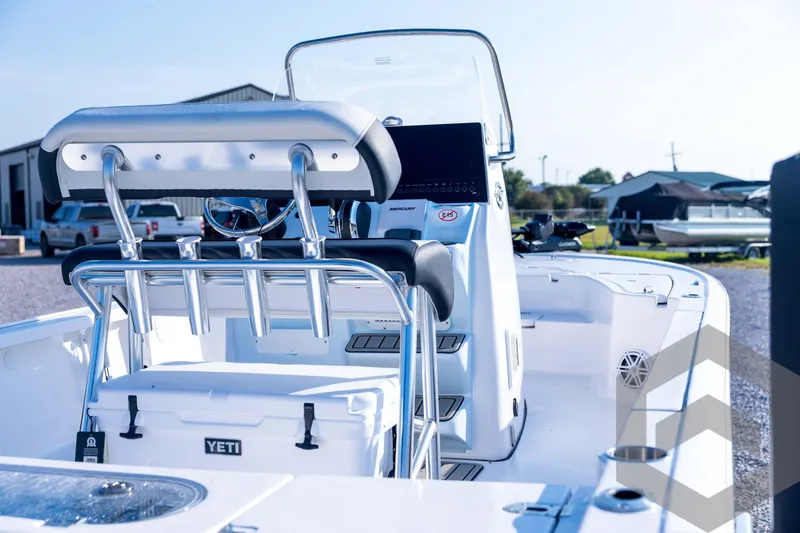 Slide: The Image of 2026 Tidewater 2110 Bay Max boat interior with seating and Yeti cooler. - 75