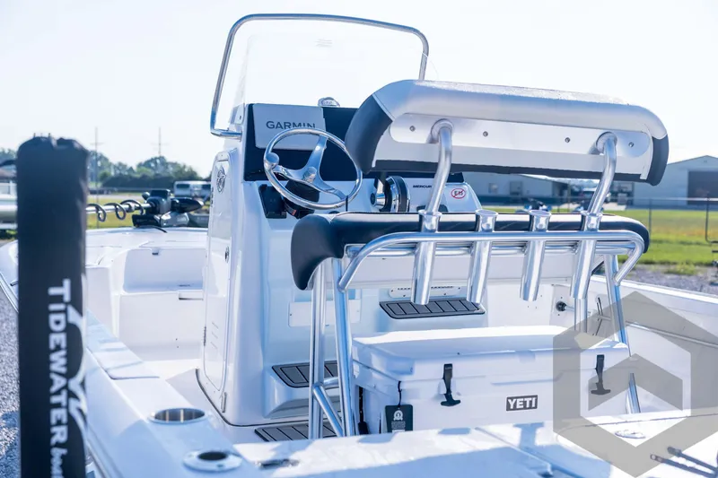 Slide: The Image of 2026 Tidewater 2110 Bay Max boat interior with Garmin navigation and Yeti cooler. - 76