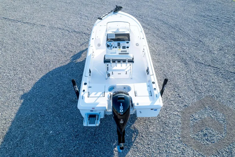 Slide: The Image of 2026 Tidewater 2110 Bay Max boat with outboard motor, aerial view on gravel surface. - 80