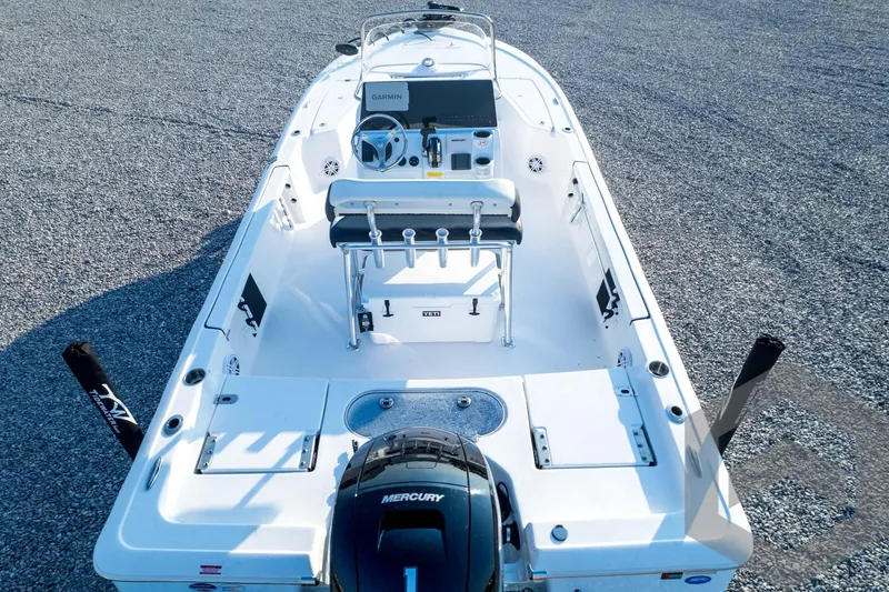 Slide: The Image of 2026 Tidewater 2110 Bay Max boat with Mercury engine, featuring a spacious deck and modern controls. - 88