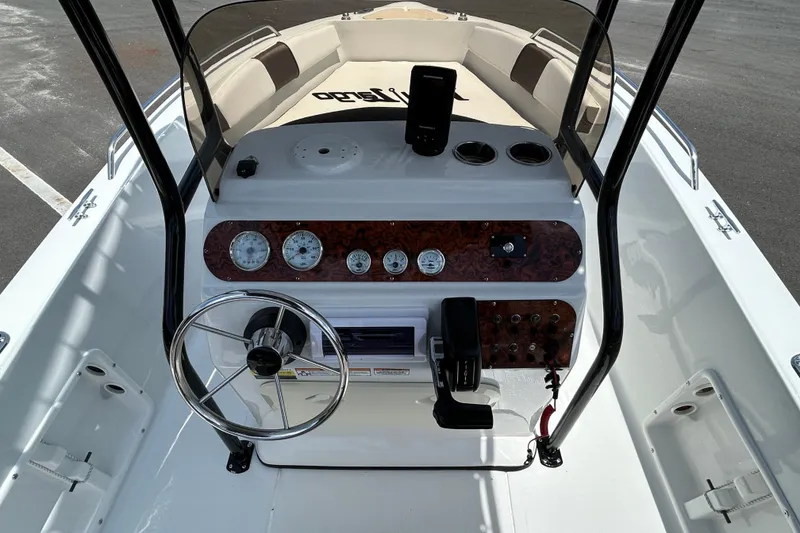 Slide: The Image of 2020 Key Largo 1800 CC boat dashboard with steering wheel and control panel. - 11