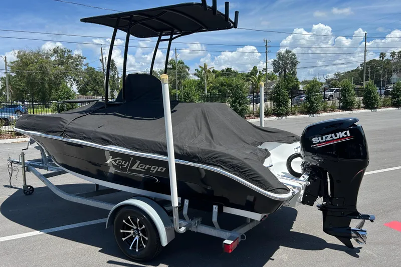 Slide: The Image of 2020 Key Largo 1800 CC boat with Suzuki outboard motor on trailer. - 17