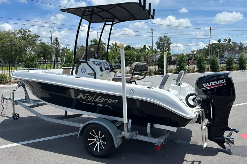 Slide: The Image of 2020 Key Largo 1800 CC boat on trailer with Suzuki outboard motor. - 4