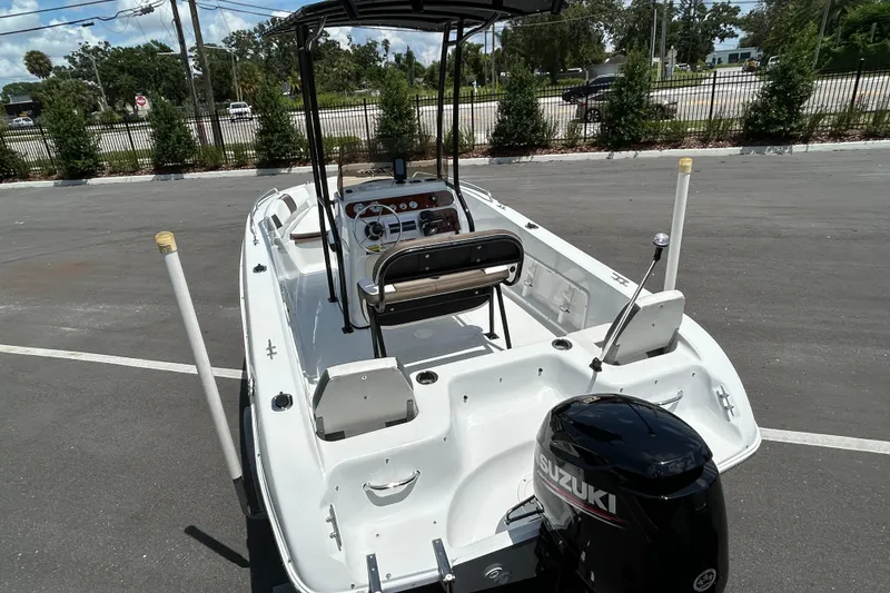 Slide: The Image of 2020 Key Largo 1800 CC boat with Suzuki outboard motor in parking lot. - 7