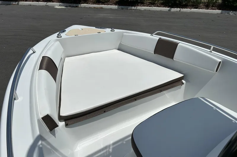 Slide: The Image of 2020 Key Largo 1800 CC boat interior with cushioned seating area. - 8