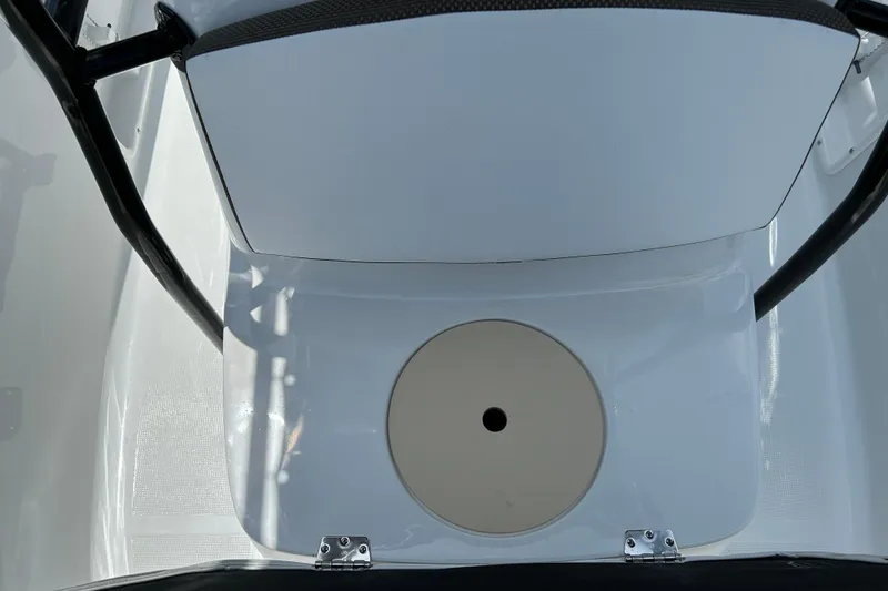 Slide: The Image of 2020 Key Largo 1800 CC boat interior with seating and storage compartment. - 15