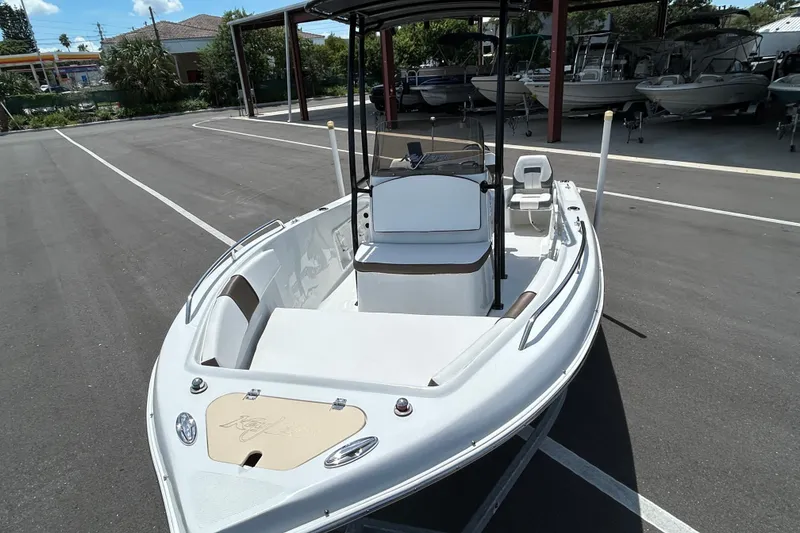 Slide: The Image of 2020 Key Largo 1800 CC boat in a parking lot, showcasing sleek design and spacious interior. - 6