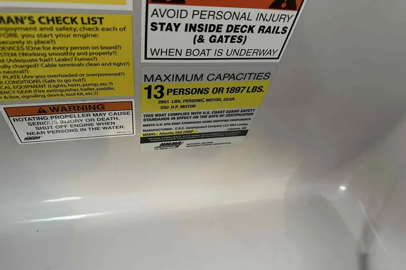 Slide: The Image of Warning and capacity labels on 2018 Landau Atlantis 250 Cruise boat. - 11
