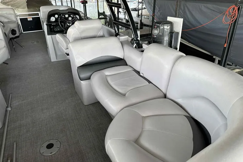 Slide: The Image of 2018 Landau Atlantis 250 Cruise interior with plush seating and modern dashboard. - 12