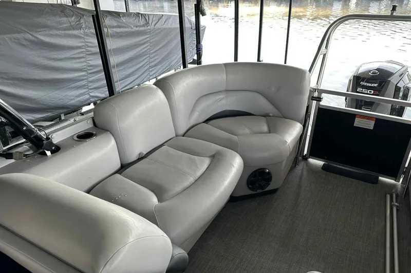 Slide: The Image of 2018 Landau Atlantis 250 Cruise boat interior with gray seating and Evinrude 250 engine. - 15