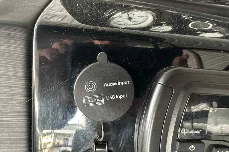 Slide: The Image of 2018 Landau Atlantis 250 Cruise dashboard with audio and USB input ports. - 16