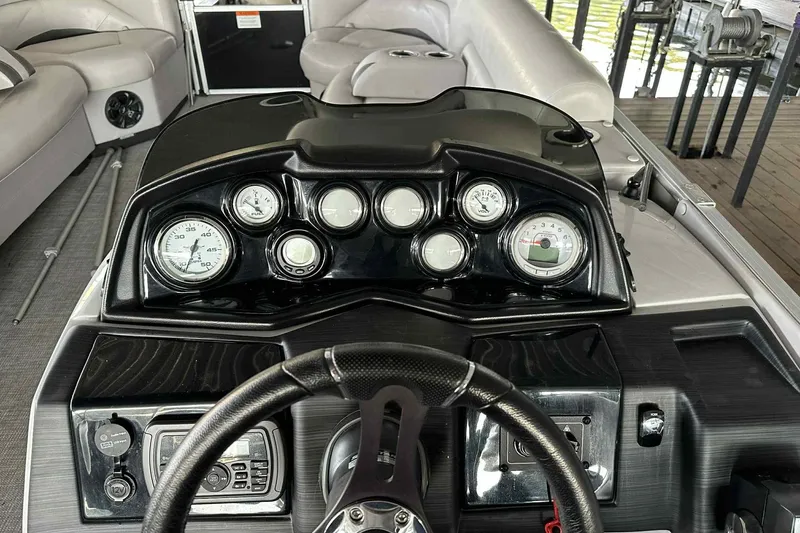 Slide: The Image of 2018 Landau Atlantis 250 Cruise dashboard with gauges and steering wheel. - 17