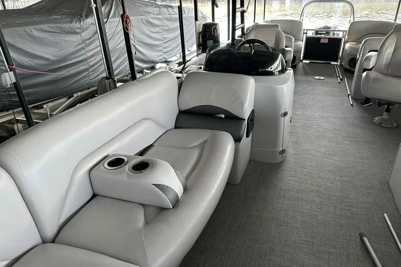 Slide: The Image of 2018 Landau Atlantis 250 Cruise interior with plush seating and modern helm. - 19