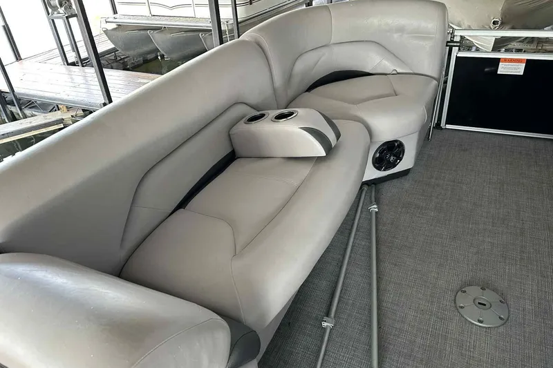 Slide: The Image of 2018 Landau Atlantis 250 Cruise boat interior with gray seating and cup holders. - 22