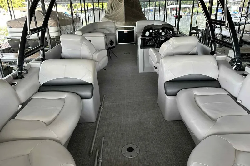 Slide: The Image of 2018 Landau Atlantis 250 Cruise interior with spacious seating and modern dashboard. - 27