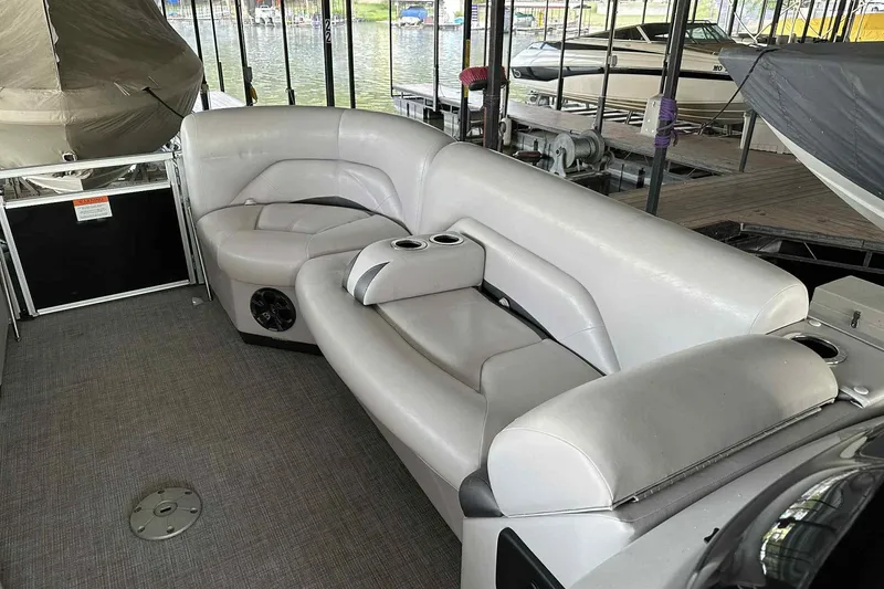 Slide: The Image of 2018 Landau Atlantis 250 Cruise boat interior with plush seating and cup holders. - 29