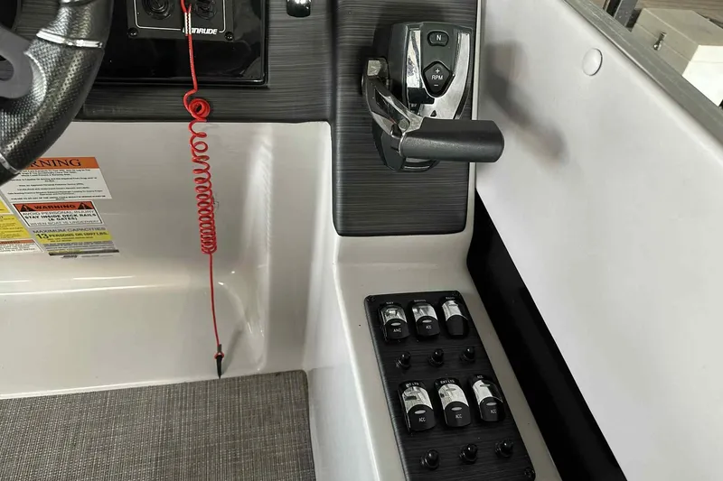 Slide: The Image of Control panel of 2018 Landau Atlantis 250 Cruise boat with steering wheel and switches. - 32