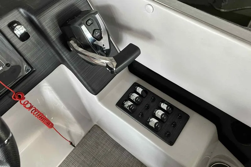 Slide: The Image of Control panel of 2018 Landau Atlantis 250 Cruise boat with throttle and switches. - 6