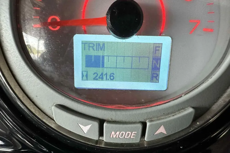 Slide: The Image of Close-up of 2018 Landau Atlantis 250 Cruise dashboard display showing trim settings. - 7