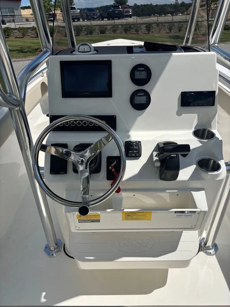 Slide: The Image of Steering console of 2026 Key West 203 FS boat with modern controls and gauges. - 12