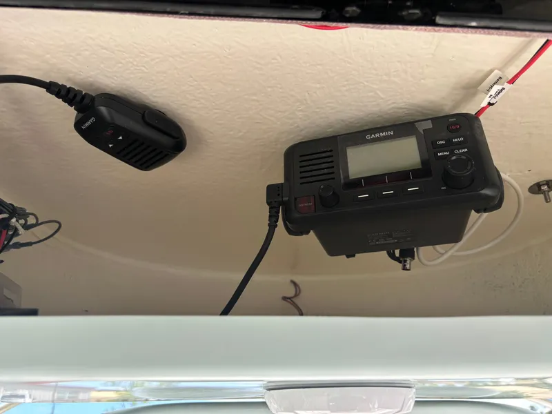 Slide: The Image of Garmin radio equipment installed on a 2026 Key West 203 FS boat ceiling. - 13