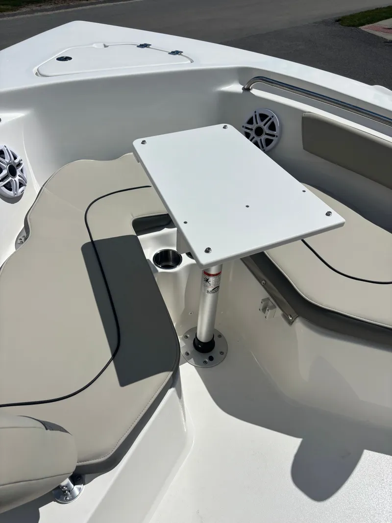 Slide: The Image of 2026 Key West 203 FS boat interior with seating and table setup. - 14