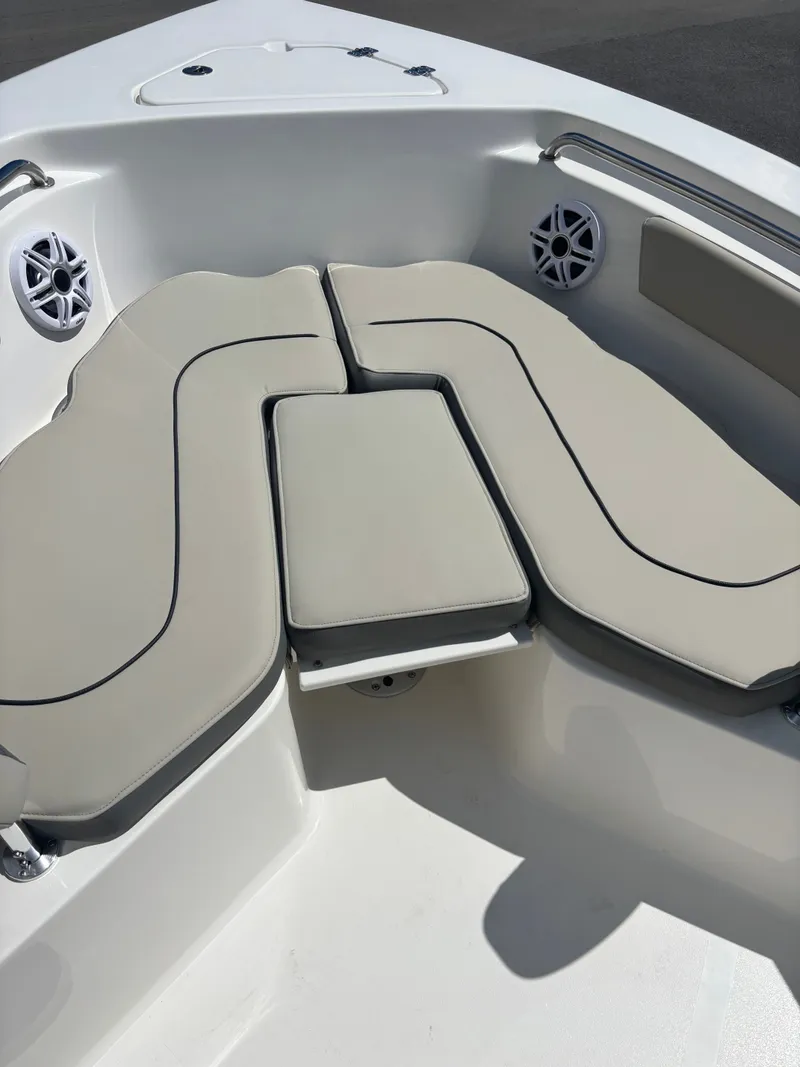 Slide: The Image of 2026 Key West 203 FS boat interior with cushioned seating and speakers. - 18