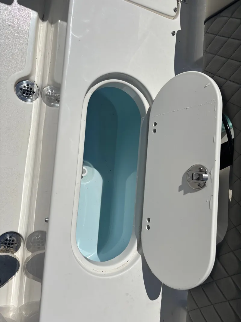 Slide: The Image of Open storage compartment on 2026 Key West 203 FS boat. - 19