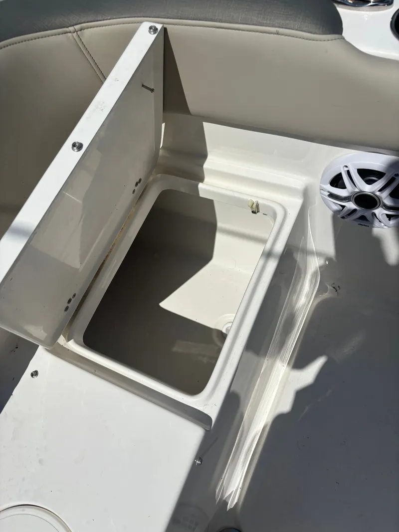 Slide: The Image of Open storage compartment on 2026 Key West 203 FS boat, featuring a speaker. - 20