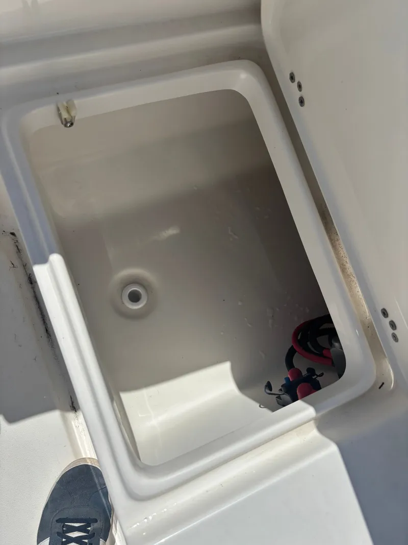 Slide: The Image of Open storage compartment in 2026 Key West 203 FS boat. - 21