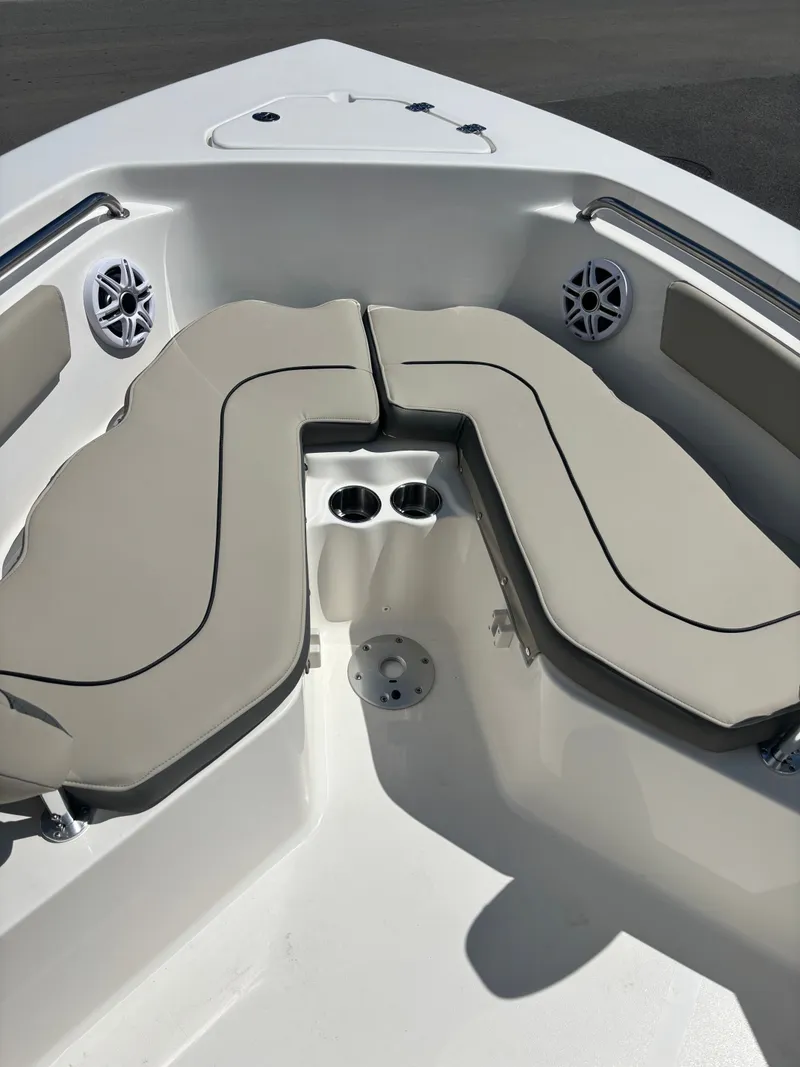 Slide: The Image of 2026 Key West 203 FS boat interior with cushioned seating and cup holders. - 6