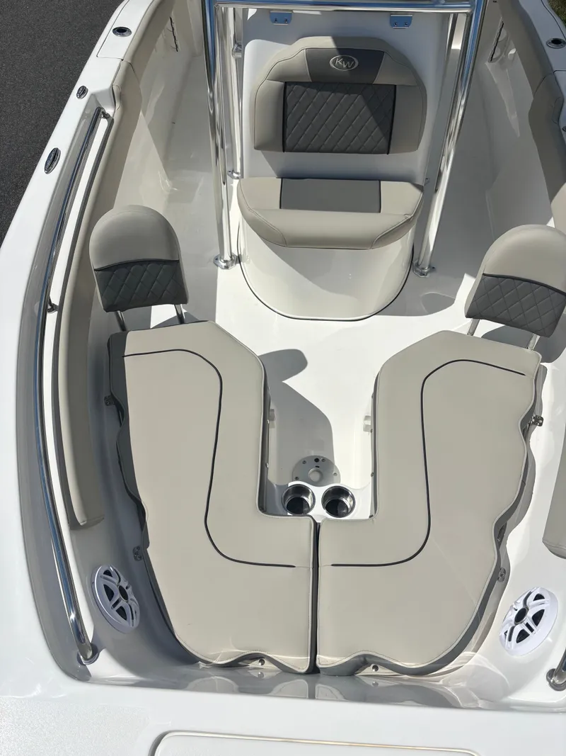 Slide: The Image of 2026 Key West 203 FS boat interior with cushioned seating and sleek design. - 7