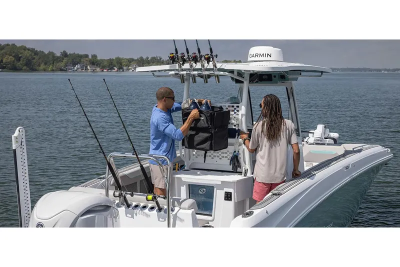 Slide: The Image of 2026 Hurricane Center Console 24 OB boat interior with seating and deck details. - 10