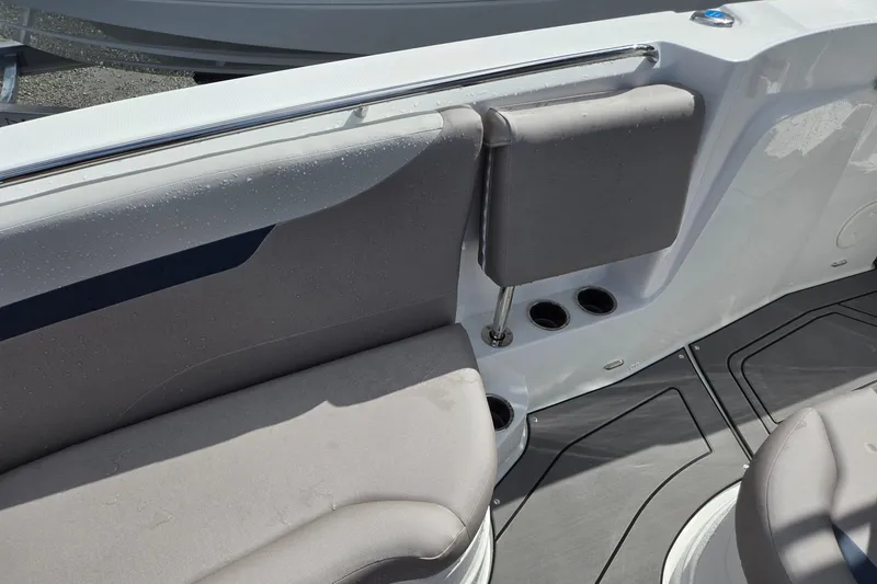 Slide: The Image of Interior seating of 2026 Hurricane Center Console 24 OB boat with cup holders. - 12