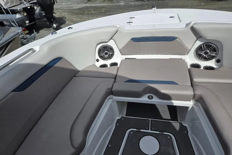 Slide: The Image of 2026 Hurricane Center Console 24 OB boat interior with cushioned seating and built-in speakers. - 15