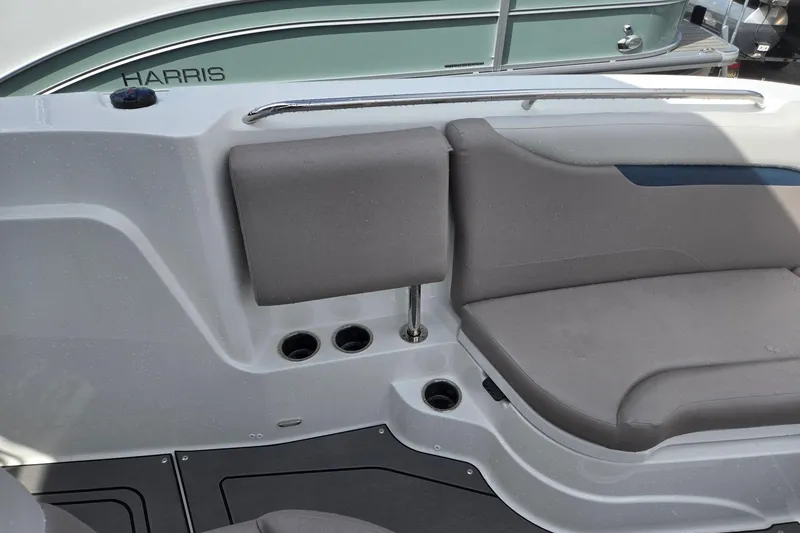 Slide: The Image of 2026 Hurricane Center Console 24 OB boat interior with gray seating and cup holders. - 16